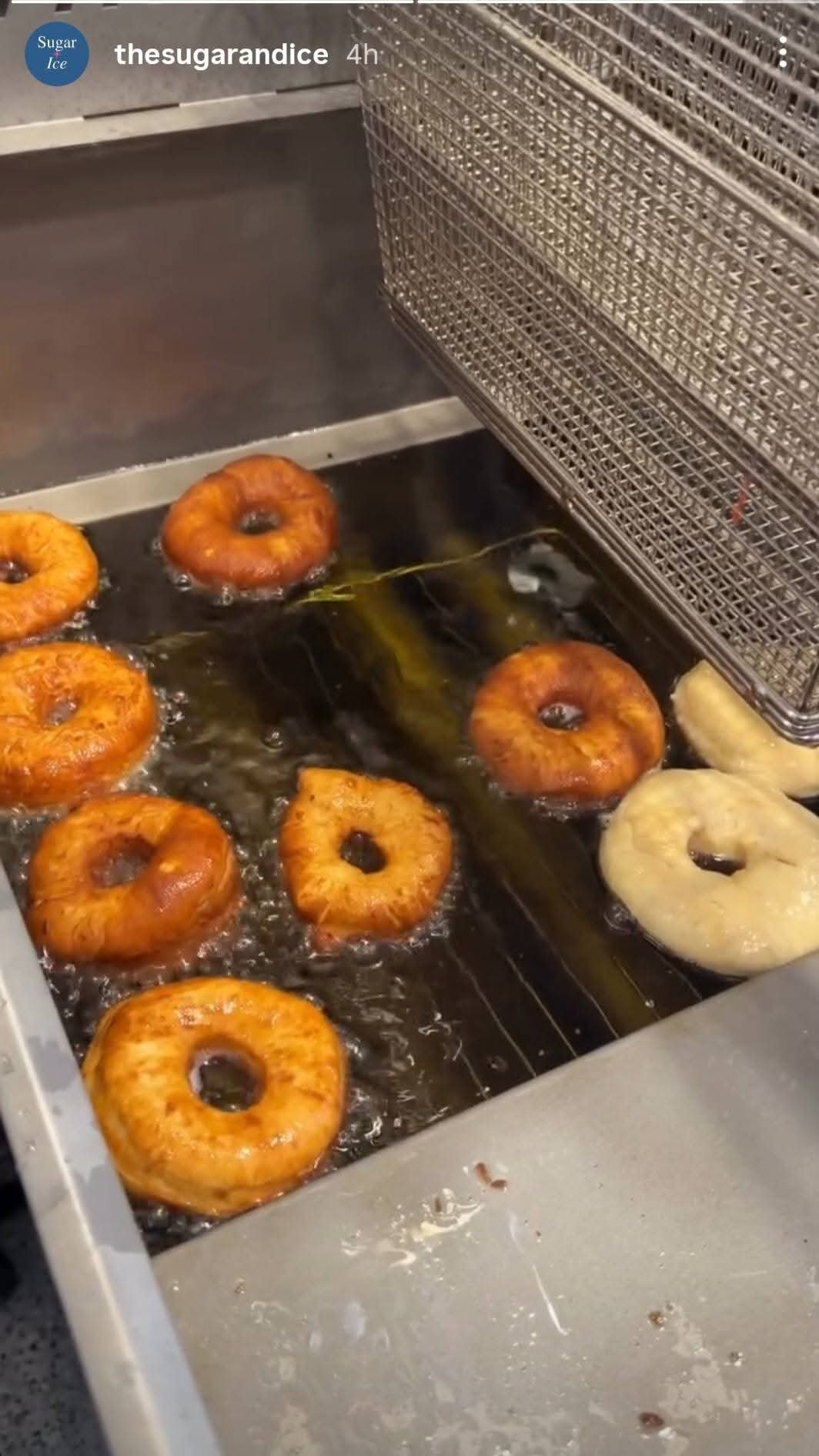 Fresh ring donuts frying in the food truck kitchen