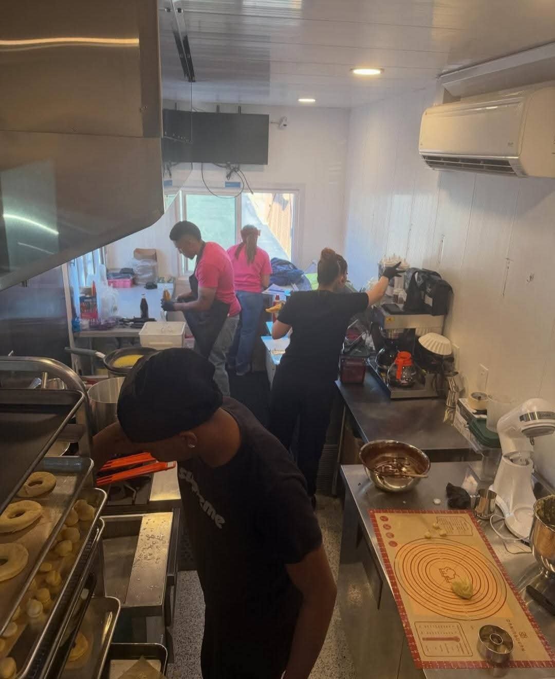 The Five Star Craves team working inside the food truck kitchen